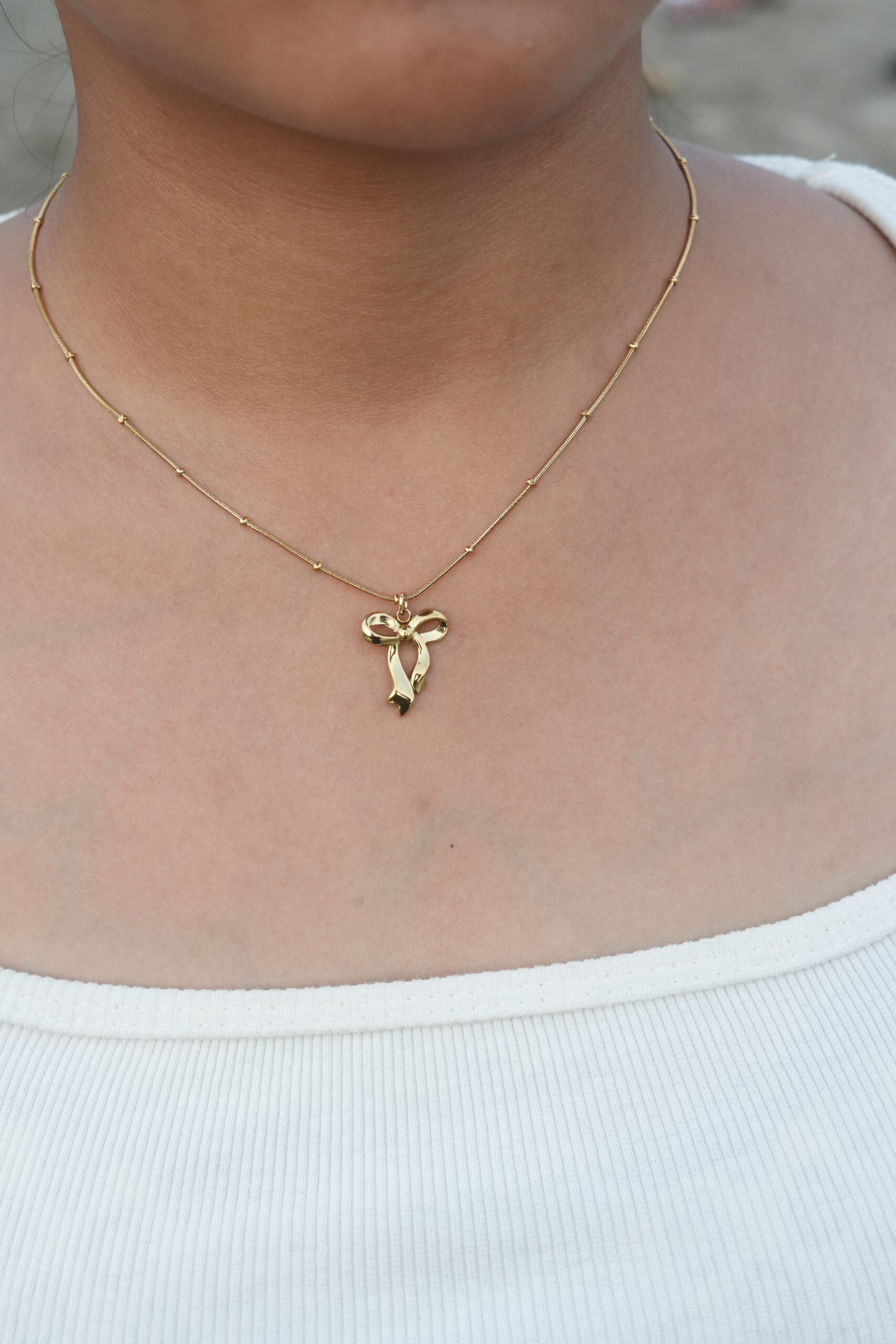 Golden Grace Ribbon Pendant Necklace - Image 2