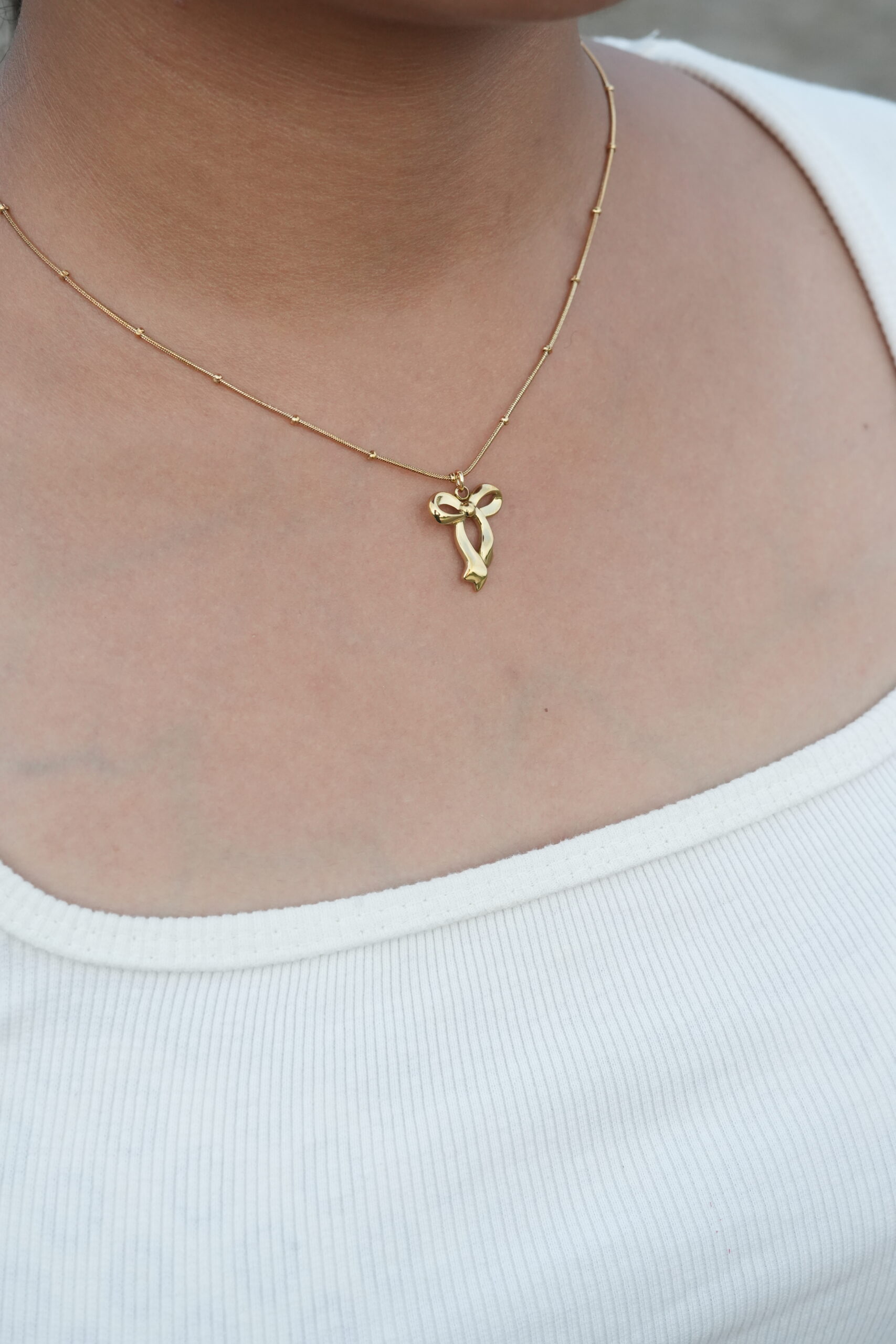 Golden Grace Ribbon Pendant Necklace - Image 3