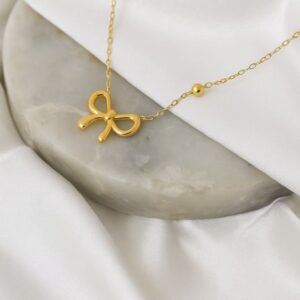 Golden Whisper Bow Necklace